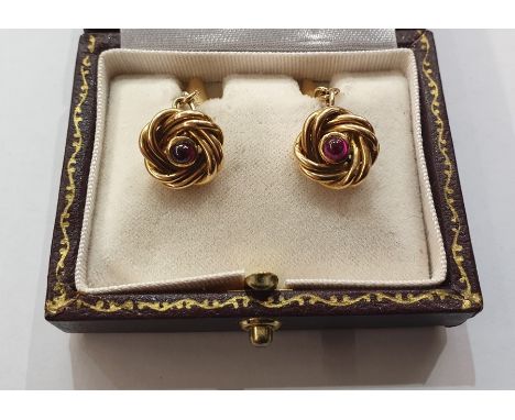 Pair gold-coloured knot, torpedo and chain cufflinks, each knot set with single cabochon ruby, approx. 11g gross in Scott Coo