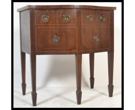 A late 18th / early 19th Century Regency Georgian satinwood inlaid mahogany bow front Sideboard, having two deep cellarette /