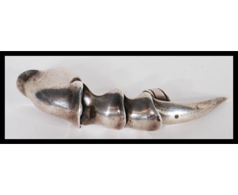 A large sterling silver finger claw / ring having articulated joints. Stamped 925. Weighs 39 grams. Measures 12cm long.&nbsp;