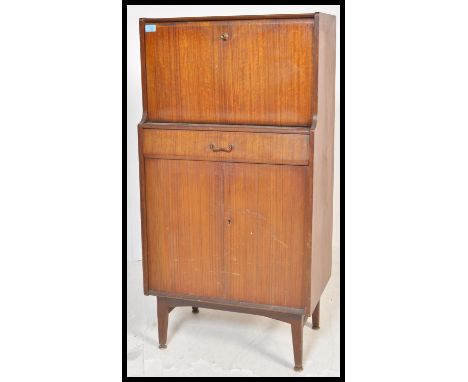 A mid 20th Century vintage retro cocktail cabinet by Nathan, full down front with mirrored interior with single drawer over t