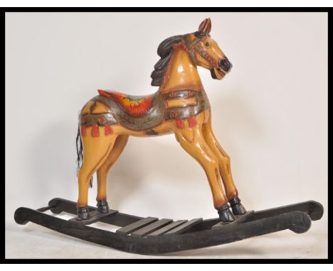 A large vintage 20th Century carousel type rocking horse raised on sleigh rockers with painted detailing and carved mane. Mea