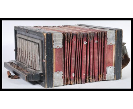 A late 19th Century musical accordion squeeze box by Zenith with ebonised wooden surround and silerered buttons AF