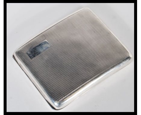 An early 20th Century hallmarked silver cigarette case by Joseph Rogers. The case of curved rectangular form with engine turn