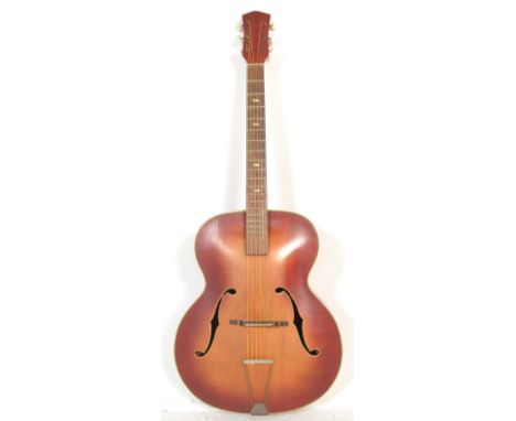 A vintage 20th Century believed Hoff six string acoustic guitar, twin F-hoes to the sunburst two tone body, mother of pearl i