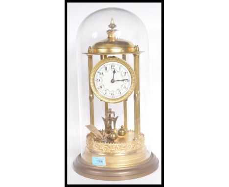 A large 19th Century Victorian glass domed anniversary clock raised on gilt brass circular base with decorated scrolled apron