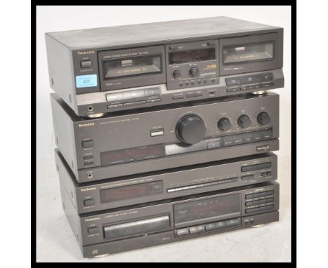 A three piece Technics hi-fi system to include a HX PRO Stereo Double Cassette Deck RS-TR313, a Compact Disc Player SL-PG100,