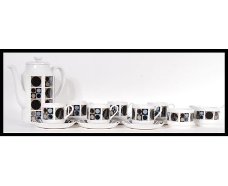 A vintage Midwinter retro 20th Century coffee service in the Focus pattern consisting of tall coffee pot, six caps with sauce