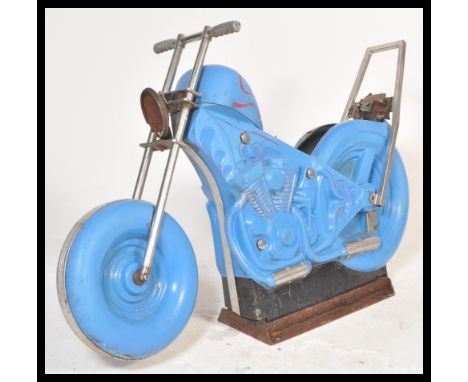 A vintage 20th Century fairground carousel ride in the form of a motorbike having blue moulded plastic body with chrome suppo