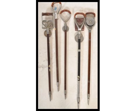 A collection of five vintage 20th Century shooting sticks to include The Perfect, an Elite, Howells, Presto and another.