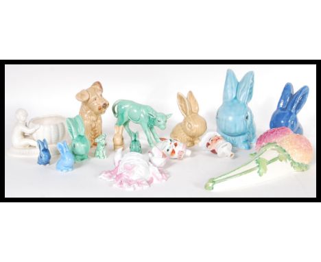 A collection of early 20th Century ceramic figurines to include a SylvaC green calf (no. 1431), a matte blue SylvaC rabbit al