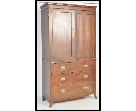 A Georgian 19th century mahogany linen press / wardrobe over chest of drawers. Bracket feet supporting a chest of two short d