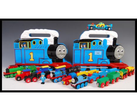 A collection of assorted Brio and associated wooden scale model locomotive trains and carriages to include; Thomas The Tank E