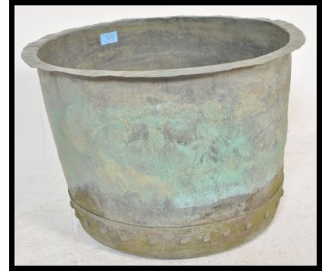 A 19th large copper coal bin / copper / planter of typical form having riveted sides and shaped flared rim. Measures 33 cm hi