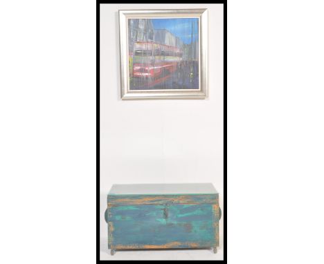 A vintage retro 20th Century painted trunk converted to a coffee table with glass top along with an acrylic painting of a Lon