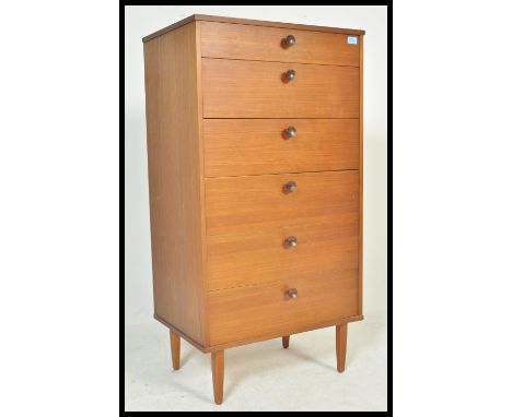 A vintage / retro 20th Century teak chest of six long graduating drawers raised on four square tapering legs, having knob han