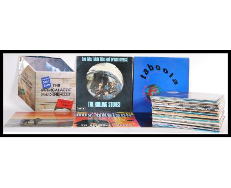 A collection of vinyl long play LP records featuring several artists to include Bob Dylan, Buddy Holly, Cream, The Rolling St