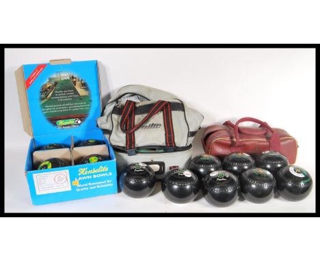 Three set of vintage 20th Century lawn bowls to include a boxes Kenselite example and two sets in vintage lawn bowls bags. Bo
