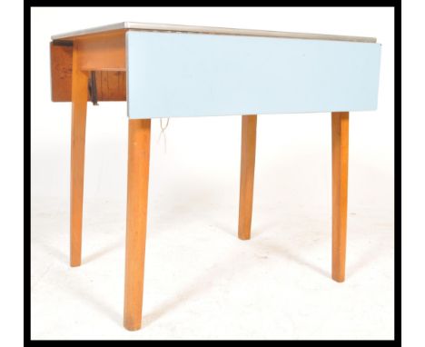 A vintage Retro 1950's / 1960's mid 20th century blue formica drop leaf Kitchen dining table, raised on beech tapering suppor