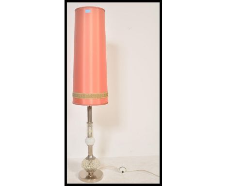 A vintage retro 1950's / mid 20th Century glass and chrome floor standing lamp, circular chrome base with faceted bulbous gla