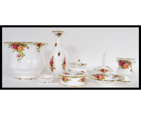 A small collection of 20th Century Royal Albert ceramics in the Country Roses pattern to include planter, vase, lidded pots e