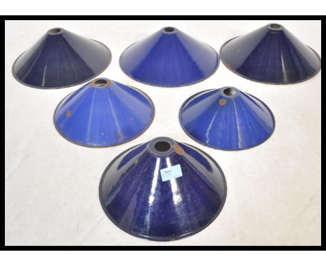 A set of six vintage retro 20th Century industrial factory pendant shades all finished in a blue enamel paint consists of thr