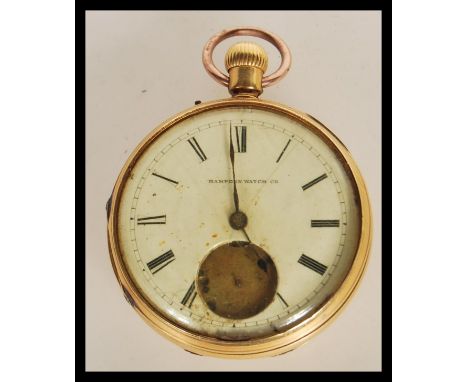 A hallmarked 18ct gold open face pocket watch marked Hampden watch company, having a white enamelled face with roman numerals