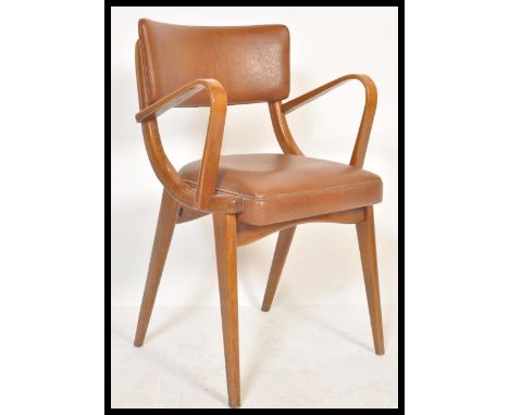 A vintage retro 20th Century Ben Chairs armchair raised on shaped angular legs with leather / faux leather seat and backrest 