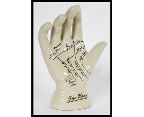 A vintage style Phrenology type Palmistry ceramic hand having instructions to palm. Measures 19 cm high x 14 cm wide.