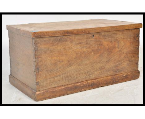 An early 19th Century Georgian elm blanket box steamer trunk coffer chest having a hinged lid with long double ended rat tail