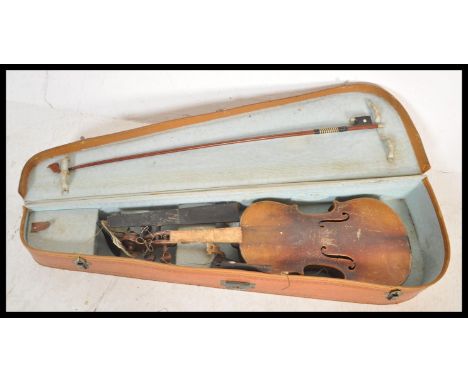 A vintage early 20th Century 3/4 size violin musical instrument having a two piece maple back with spruce front. Ebonised nec