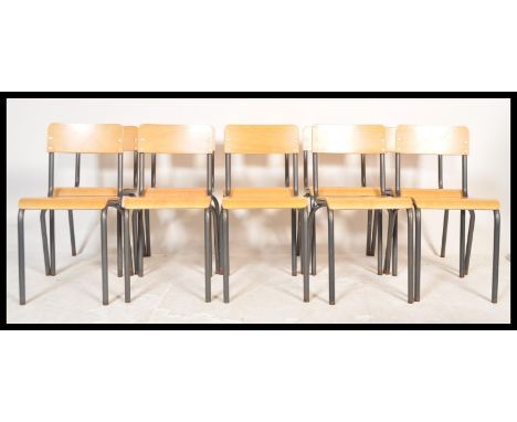 A set of ten 20th Century vintage industrial stacking ( dining )&nbsp; chairs constructed from beech ply seats and back rests