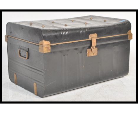 A vintage early 20th Century ebonised and gilt Japanned tin steamer trunk, hinged top with brass locks and latches to the fro