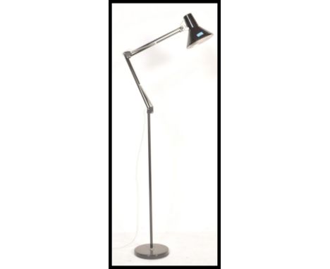 A retro 20th Century floor standing oversized anglepoise style standard lamp, raised on a circular base with pendant shade wi