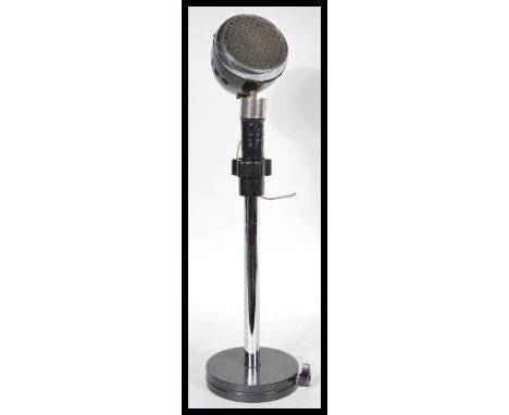 A vintage retro 20th Century Art Deco 1930's microphone in black bakelite mounted on a metal stand with square base. Measures
