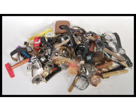 A collection of vintage 20th century watches to include a wide selection of designs, some ladies and some mens watches, brace