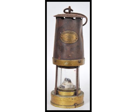 A vintage early 20th Century miner's safety lamp, applied plaque reading Paterson Lamps Ltd of Gateshead - on -Tyne. Measures