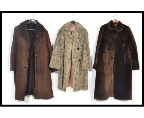 A selection of three vintage retro coats to include a brown sheepskin coat by Richard Draper, a grey lambs wool ladies double