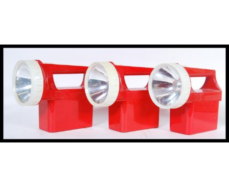 A set of three vintage Eveready hand lamp torches with original Eveready 6 volt batteries. Each in a vibrant red colourway. M