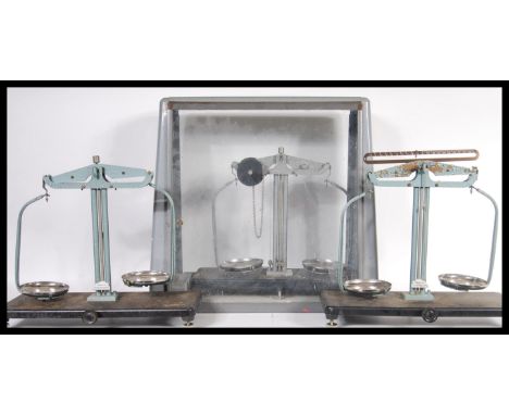 Three sets of vintage 20th Century Griffin and George chemists laboratory scales, one being cased. Largest measures 46 cm hig