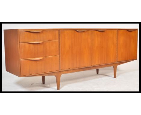 A.H. McIntosh Of Kirkcaldy - Dunvegan range - A 1960's retro vintage teak wood sideboard having the central twin door cupboar