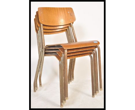 A set of four vintage mid 20th century church / village hall stacking chairs. With tubular frames having panel seats and back