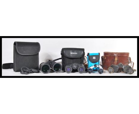 A collection of binoculars to include a pair of vintage 20th Century binoculars in leather carry case, a pair of Trailfinder 