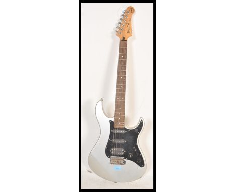 A vintage Yamaha Pacifica PAC112X stratocaster style electric six string guitar. Silver, with black scratchplate, and a humbu