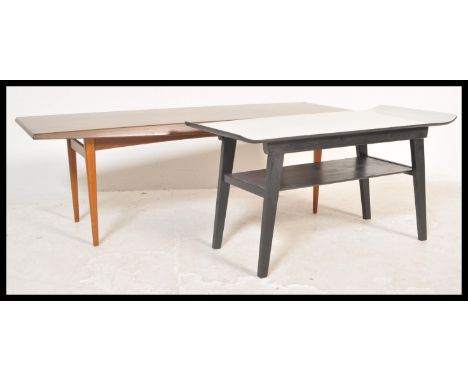 Two vintage retro 20th Century coffee tables to include a teak Gordon Russell example and a formica veneered example. Measure