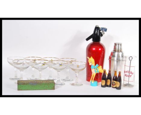 A fabulous collection vintage 20th Century advertising items to include a set of eight Babycham glasses, a Babycham faun, sil