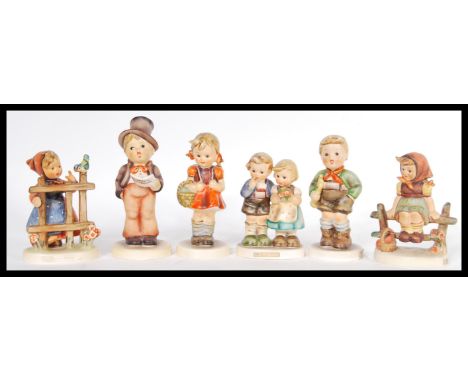 A group of six vintage 20th Century West German Goebbels ceramic figurines to include Trumpet Boy 97, Schoolgirl 81, 131 Stre