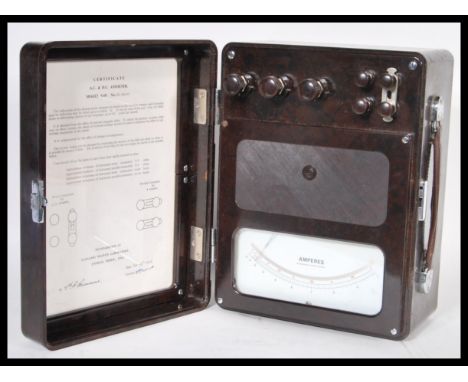 A vintage bakelite 20th Century AC/DC Voltmeter by Sangamo Weston, Enfield, London. Signed certificate of standardisation on 