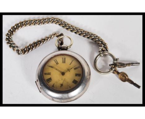 An early 20th Century silver white metal pocket watch having a white enamelled dial with roman numerals to the chapter ring, 