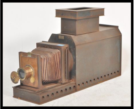 A good early 20th century Gaumont brass and tin plate magic lantern slide viewer, brass lens and cover with applied makers pl