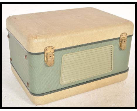 A vintage mid 20th Century two tone portable reel to reel player by Revox, built in speaker lift off hinged front and carry h